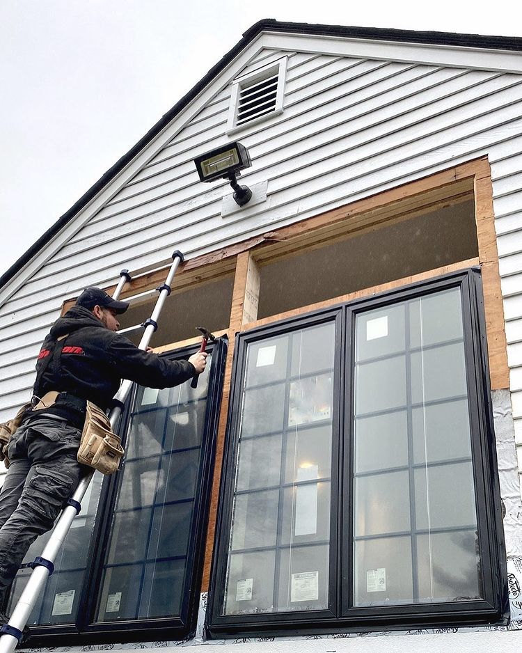 Iwano & Sons employee replacing windows for client