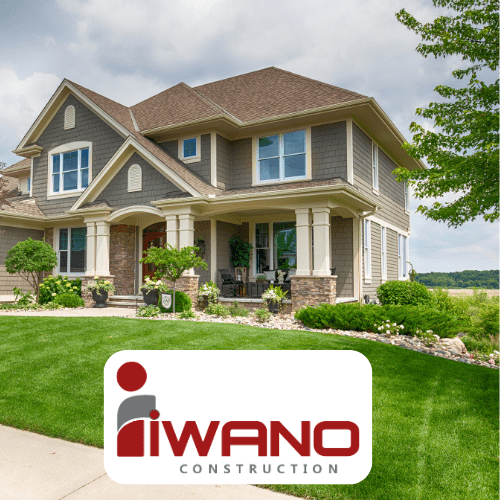 large house with green grass and Iwano Construction logo