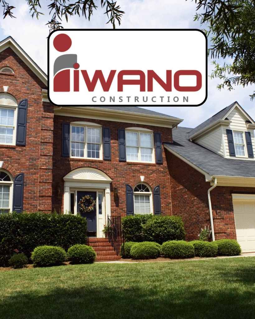 brick suburban house with Iwano Construction logo
