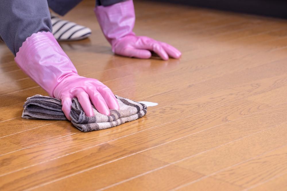 Hardwood floor being cleaned and waxed