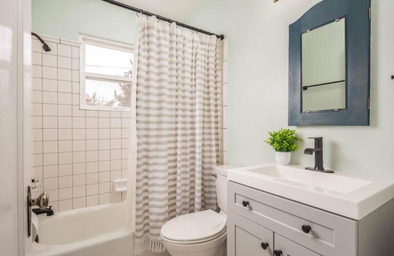 Small decorative bathroom with updated appliances