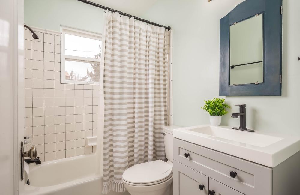Small decorative bathroom with updated appliances